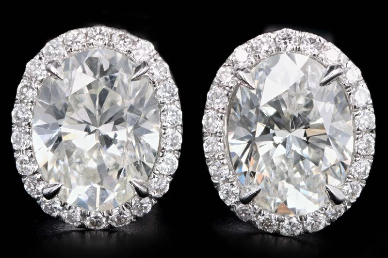 18K White Gold 1.68 Carat Total Weight Oval Cut Diamond Halo Stud Earrings